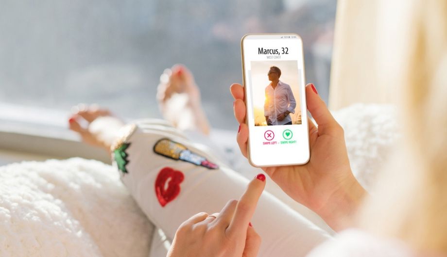 Woman using dating app on mobile phone